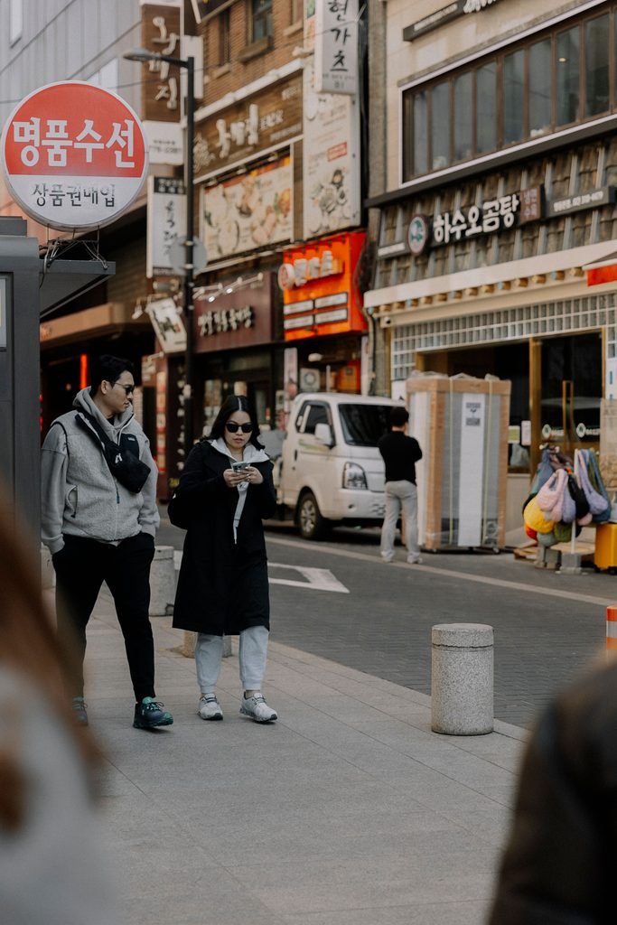 Tourist using Korea travel apps for foreigners while exploring Seoul