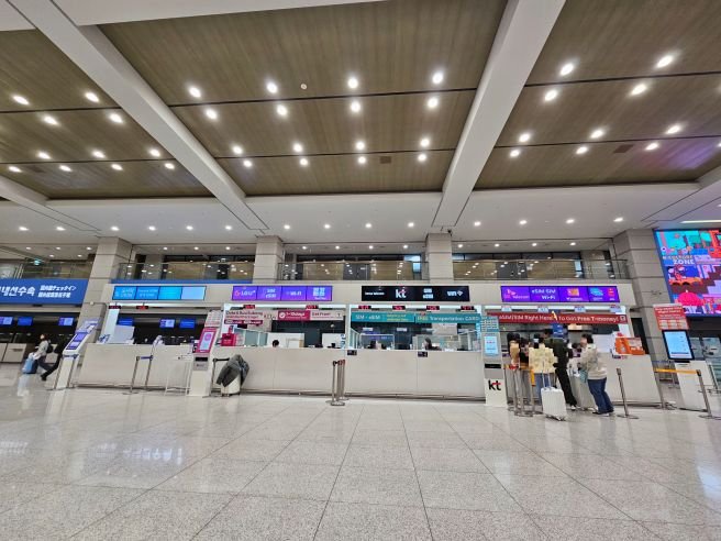 Arrivals hall at Incheon International Airport, where Korean carrier counters sell SIM cards and pocket Wi-Fi