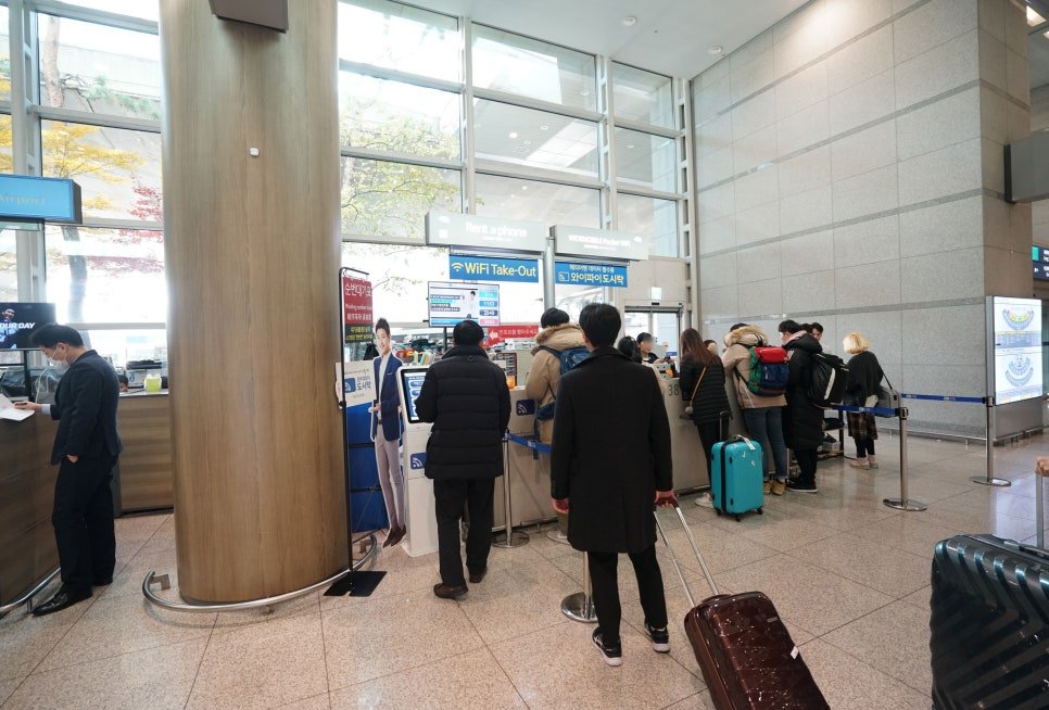 Korean mobile carrier counters for SIM cards and pocket Wi-Fi at Incheon Airport arrivals