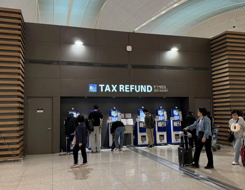Terminal hall at Incheon International Airport where tourists complete the tax refund step before checking bags