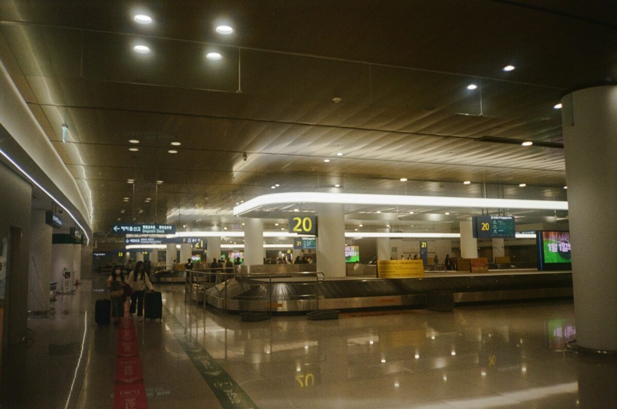 Baggage claim hall at Incheon Airport, where the choice between AREX and an airport bus begins