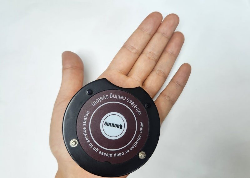 Vibrating pickup buzzer on a cafe table in Seoul