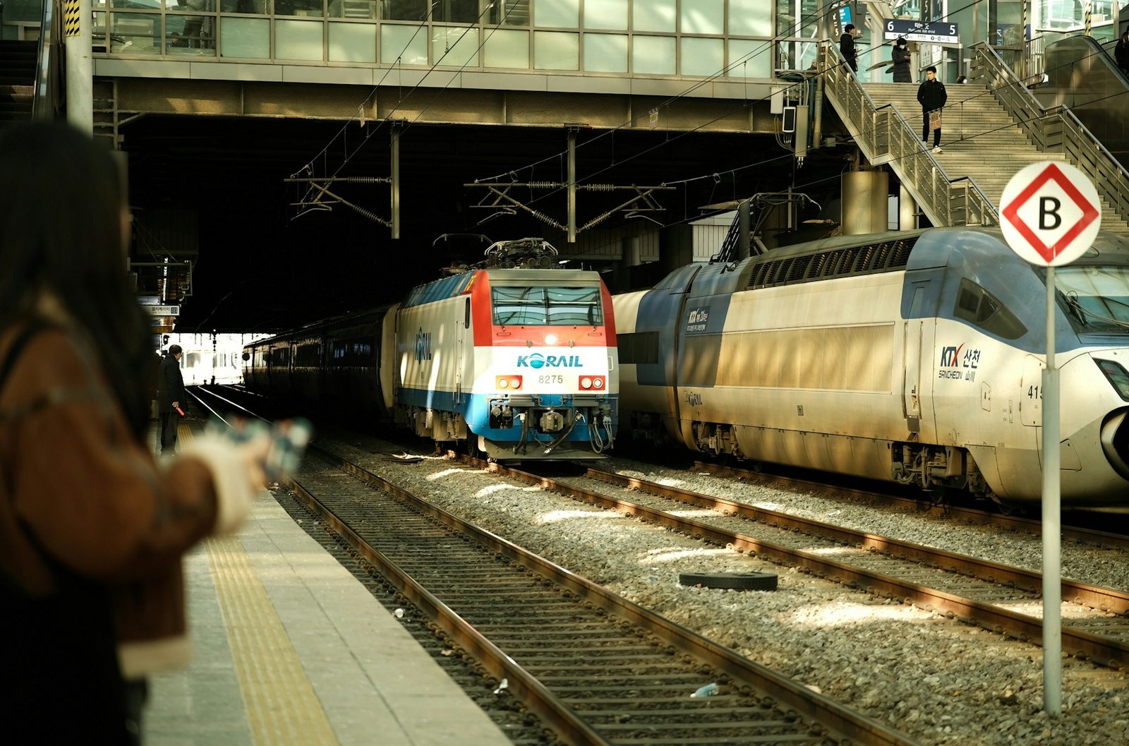 KTX-Sancheon train beside a Korail locomotive at a Korean station, after the 2026 KTX SRT merger