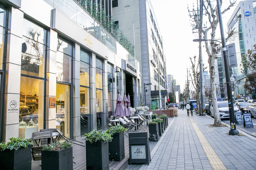 Seoul street lined with coffee shops showing Korea's cafe density